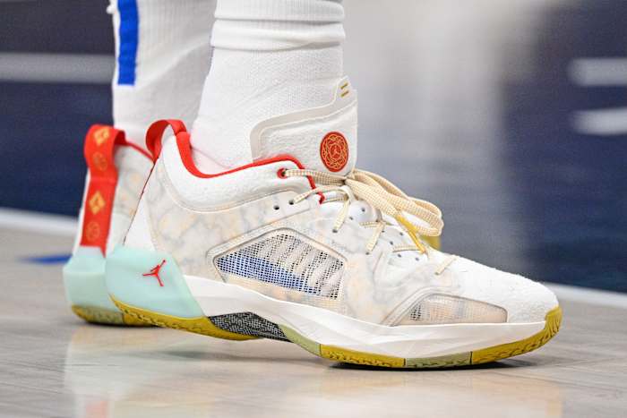 View of tan and red Air Jordan shoes.